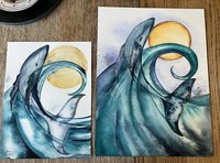 2 watercolor paintings of blue whale arching out of aqua wave with a golden moon