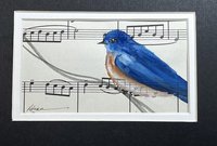 watercolor painting of bluebird on sheet music shown in Black mat