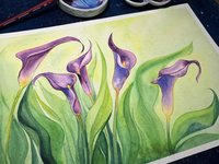 a view of the artist's desk with watercolor of purple calla flowers
