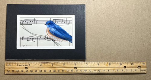 reference photo of painting of bluebird next to ruler for size reference