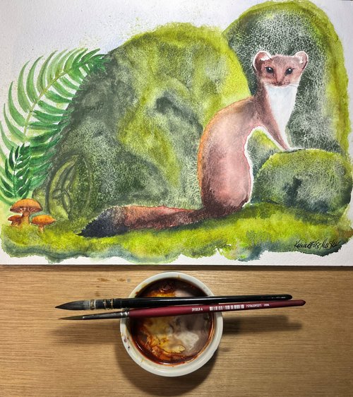 image of watercolor painting on desk with paint brush and palette