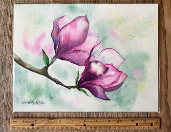 watercolor painting of magnolia blossoms and a wooden ruler for size comparison
