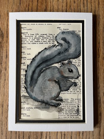 painting of grey squirrel on vintage page of text - image shows mat