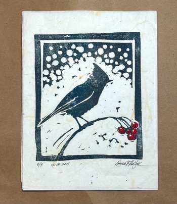 block print of songbird on berry branch with snow